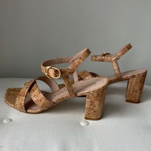 Stuart Weitzman block her sandals.